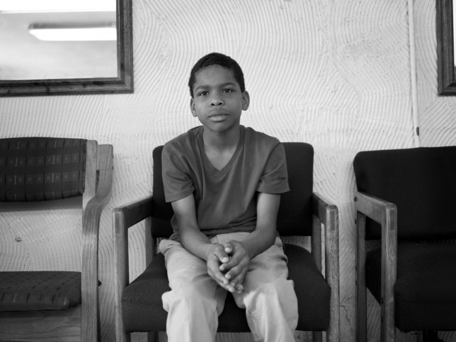 Young Boy Waiting, Jessie's Barber Shop