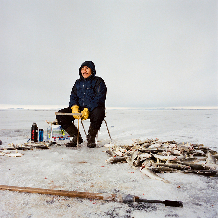 KIVALINA, ALASKA - 2007: Sylvester Swan Jr. Tom Cod Fishing.