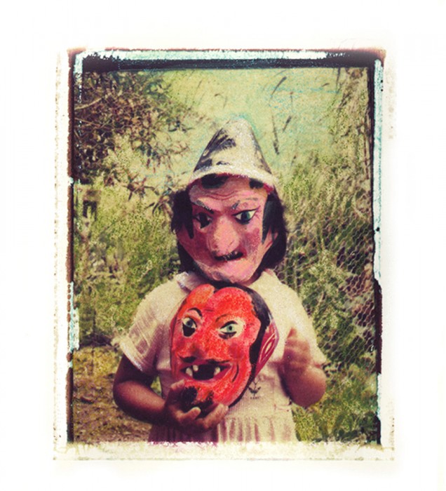 4. Girl in red mask holding devil mask