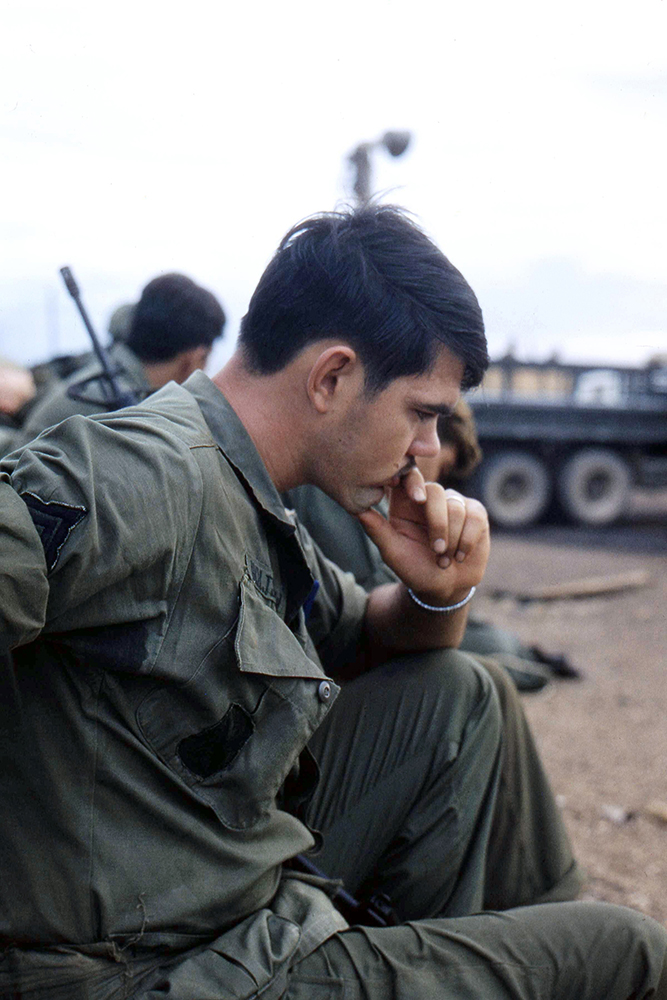 Image 14 Jay ArthursNICK HOLTSCLAW WAITING FOR A HELICOPTER OUT OF FIREBASE LZ STINSON QUANG NGAI PROVINCE, VIETNAMJay ArthursSP4-E4, Company E, 1/52nd Infantry Battalion, 198th Light Infantry Brigade, Americal Division, USARVVietnam March 1969 – April 1970