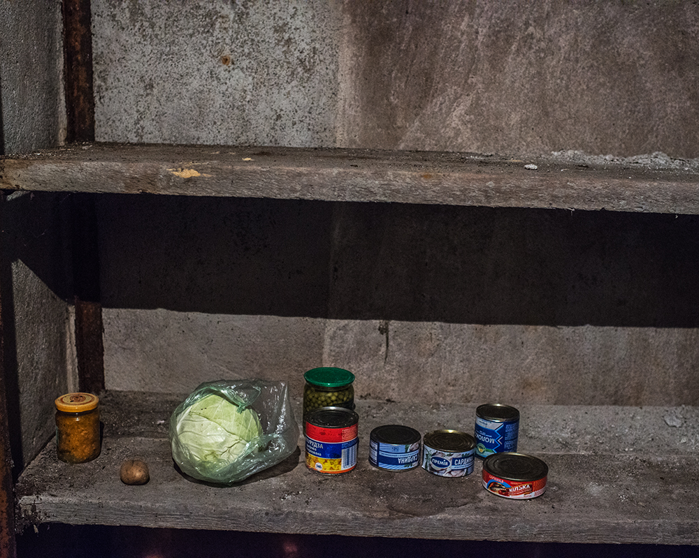 A bare cupboard in the village of Gnutove. Food prices have skyrocketed and deliveries to stores near the front line have grown less frequent. Increasingly, people must rely on food they've stored or are able to grow themselves.