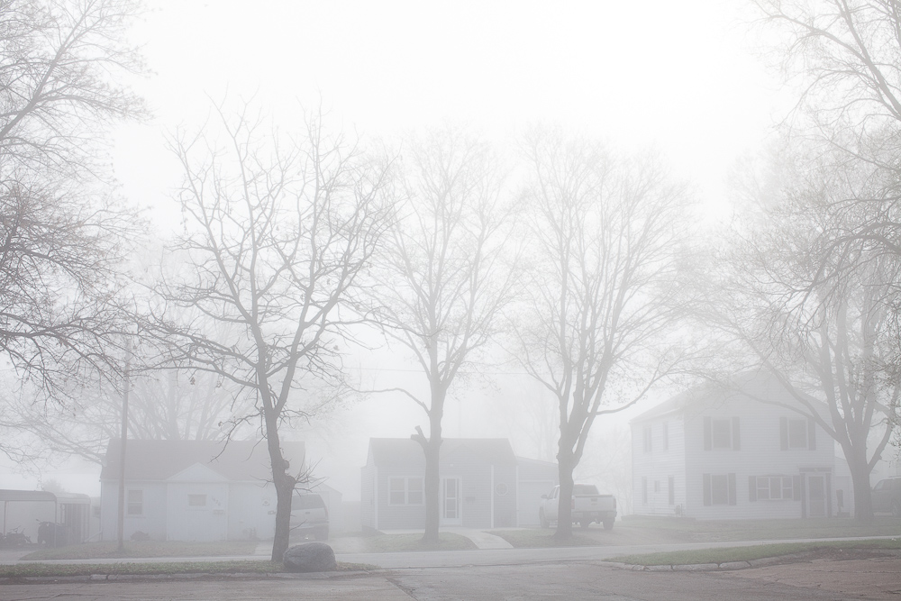 Morning fog obscures houses on Friday, March 23, 2012 in Webster City, IA.