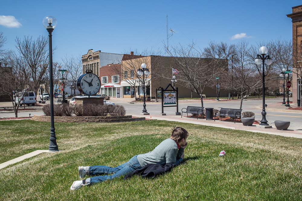 Cody Sleiter, age 17, lays in the grass after being suspended from school on Wednesday, April 24, 2013 in Webster City, IA.