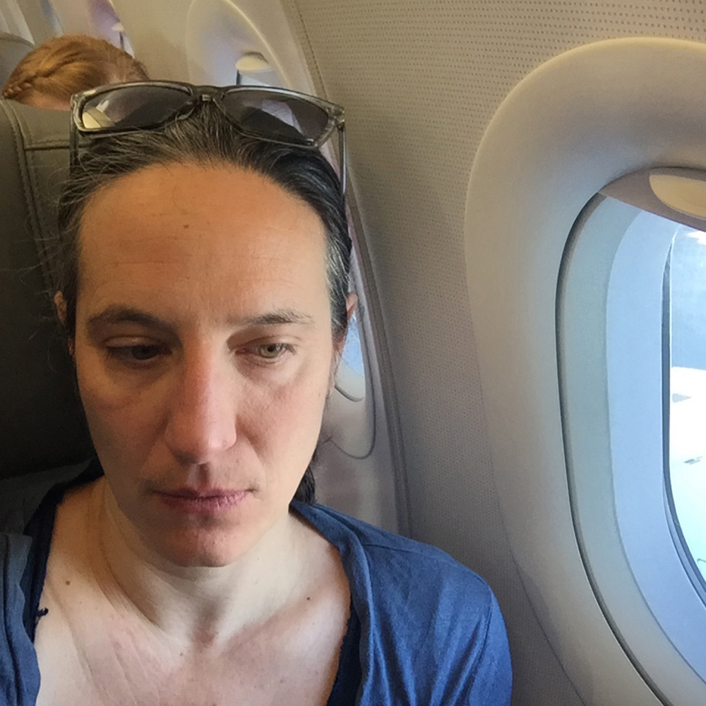 Self Portrait on a Plane (Boston, MA, to San Francisco, CA), 2015