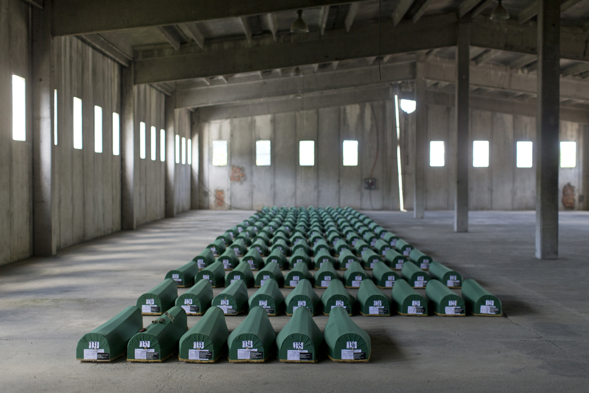 Coffins containing the remains of victims of the Srebrenica genocide are laid out at the Potocari memorial complex, Srebrenica, Bosnia and Herzegovina, July 10, 2011. In 2004, the International Criminal Tribunal for the former Yugoslavia ruled that the mass killings of Srebrenica's male inhabitants by Bosnian Serb forces, one of the worst atrocities of the 1990's Yugoslav wars, constituted genocide. Bosnian Serb and Serbian officials often dispute the genocide qualification, calling the crime a massacre instead.