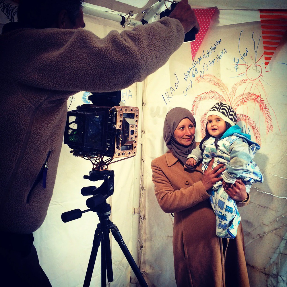 © Sandi Sandelier Blankenship, "Us & Them" photo shoot of an Afghani refugee and her baby in the Moria Refugee Camp in Lesbos, Greece.