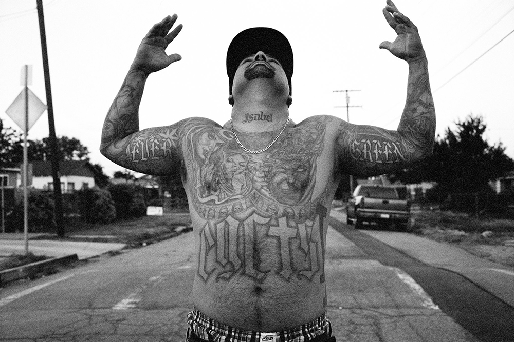 2016: A former gang member who is now a rapper, the K.A.S., a.k.a. Lil Kasper. Credit Joseph Rodriguez for The New York Times.