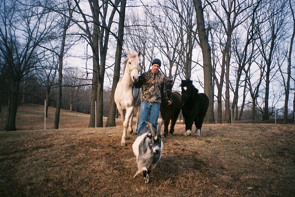 Brian walks his familyÕs farm animals from their pens to the barn in Danville. Brian served in the Navy for four years Ñ staying in 12 different countries Ñ before returning home to care for his ailing grandfather. He moved to Colorado in early 2018 and I have not heard from him since.