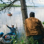 A group elders pull up to shore on Ekali Lake, near the small community of Jean Marie River, NWT. The area is rich in history - archeologists have uncovered many signs that this particular spot was an important meeting place (stone knives, buried fire pits and tools have been found here.)