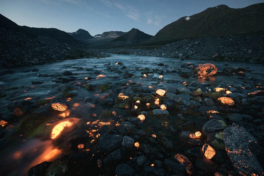 In the village of Narsaq, Greenland, stones containing rare-earth minerals glow in the exposure of an ultraviolet flashlight. They contain minerals like neodymium, which is a finite resource used in electronics, as well as radioactive uranium. Large deposits of rare-earth minerals remain exceedingly rare outside of China, making sites like the proposed Kvanefjeld mine controversial and political.