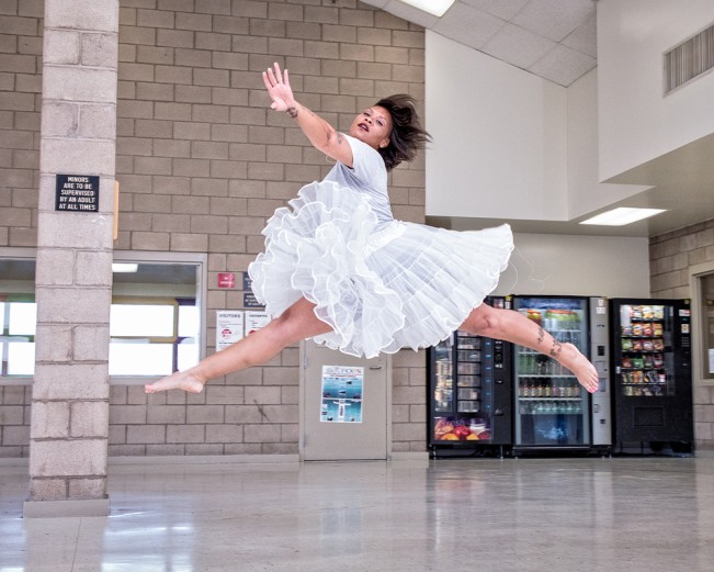 A dance student practices in a visiting room, at Central California Women's Facility. 2017