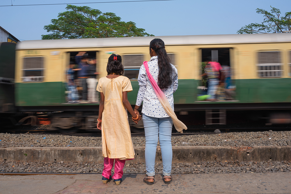 M., who is now 18, waits for a train with her cousin in South 24 Parganas, a largely poor district in West Bengal with a high incidence of trafficking. A man M. met in a class sold her to a brothel in Delhi. She managed to call her father and was rescued by police with help from a nonprofit called Shakti Vahini. “This incident is a dark episode in my life,” M. said. “When I came home, I was scared and ashamed. But I am not afraid anymore.”