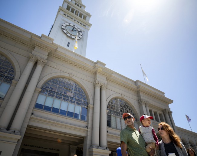 D- Rubin Sidhu and Jenny Mullins moved to San Francisco years ago. The couple leave the Ferry Building with their 2-year-old son, Tej Mullins, at the San Francisco Bay on Sunday, May 22, 2022.