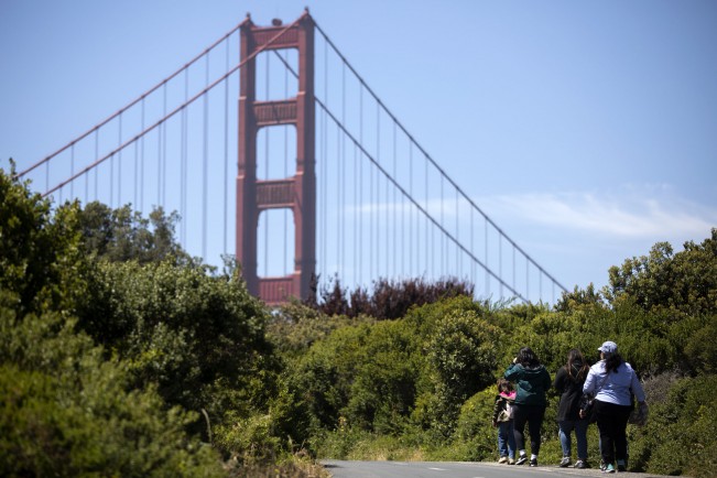 D- Aubrey Smith, 5, leads her family to the Golden Gate Bridge on Saturday, May 20, 2022 in San Francisco, California. The family traveled from Los Angeles because to be somewhere new that still feels like home.