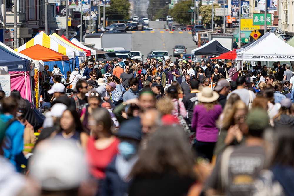 A: Clement Street comes alive as San Franciscans attend a farmers market on a sunny Sunday afternoon. This weekly market allows business owners to connect with their community and attain dreams they have for their business.