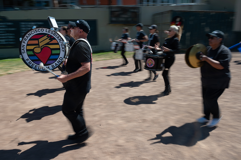 F - Gary Cozzi, plays the bass drum and practices marching during a rehearsal at Rikki Streicher Field on Sunday, May 22, 2022 in San Francisco. After a performance that morning in The Castro District the band began practicing for the upcoming San Francisco Pride Parade.