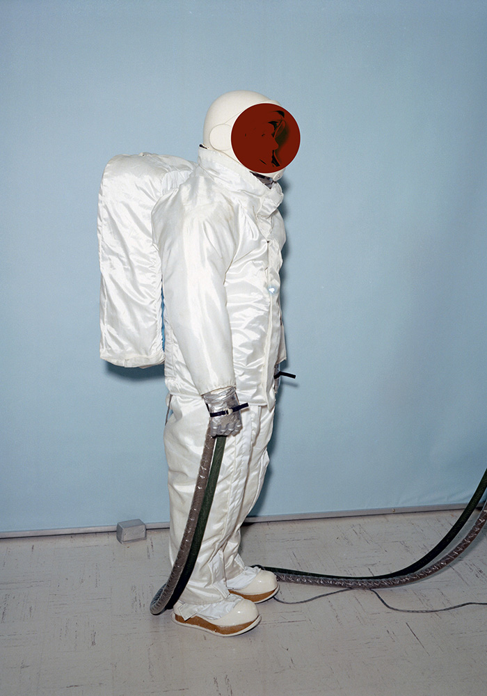 Manipulated NASA image of a spacesuit overgarment fitting at Johnson Space Center, which would be worn over the Apollo suits while astronauts were on the moon, May 18, 1965.