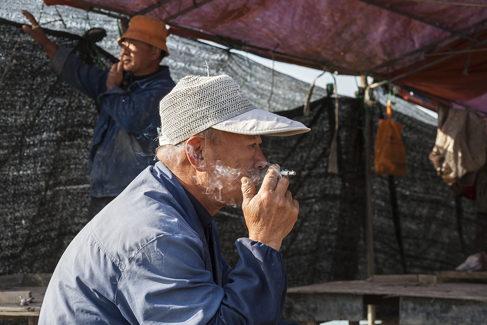 Photograph of fishermen taking a break in Shandong province in East China.
