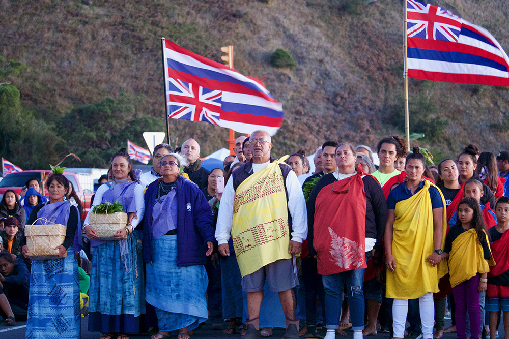 ©Kapulei Flores, No ka lāhui (for the people), 2019. During the 2019 frontline stance for Mauna Kea we saw how powerful our communities are, especailly when we come together. Pictured are members of the makaliʻi ʻohana who have been pillars of our communities and to me represent all the beautiful things that can be created when people come together to support eachother and make things happen.