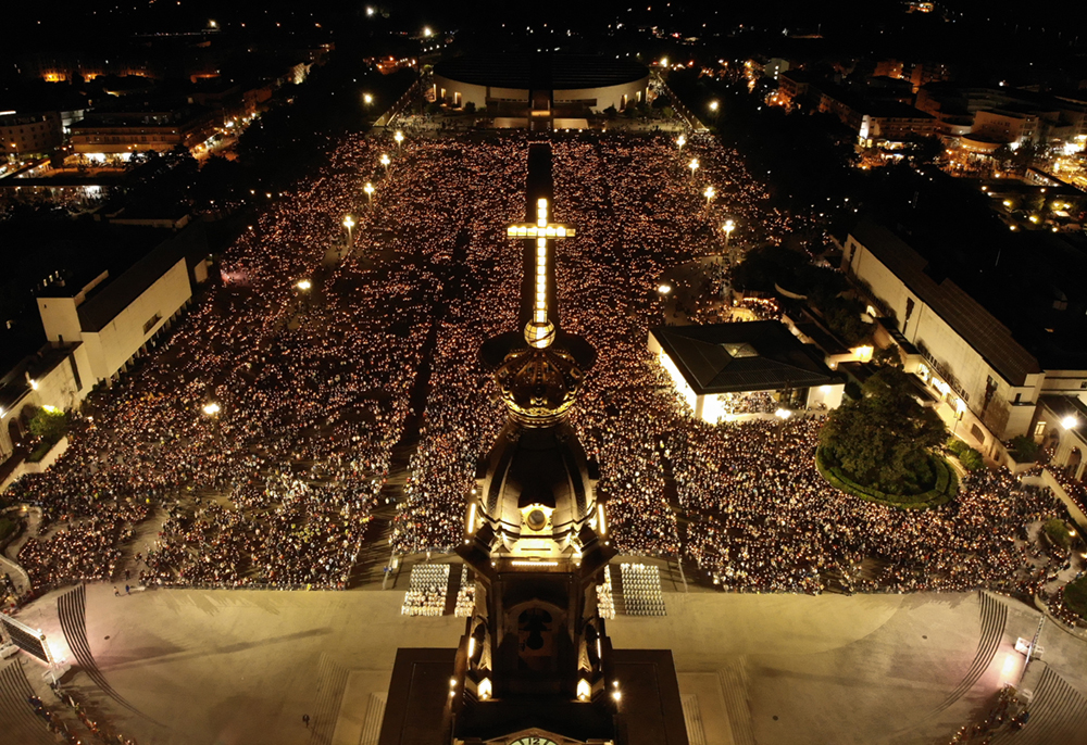 People join together to light a candle and pray as the annual event on Thursday 12 May in Fatima, Portugal. The Sanctuary of Fátima annually welcomes hundred of thousands of pilgrims and tourists. Many come to participate in the celebrations that commemorate the apparitions of Our Lady to the three witness of Fátima. Fatima is one of the most important religious pilgrimage sites in the world. Pilgrims travel to Fatima year round but the 13th of the months of May to October are the days that celebrate the apparitions of the Virgin Mary to the three shepherd children at the Cova da Iria ( a valley) in the parish of Fatima in 1917
