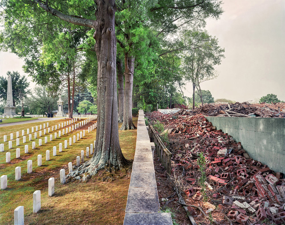 A Civil War cemetery is seen in contrast to a destroyed Cotton Mill in the American South.