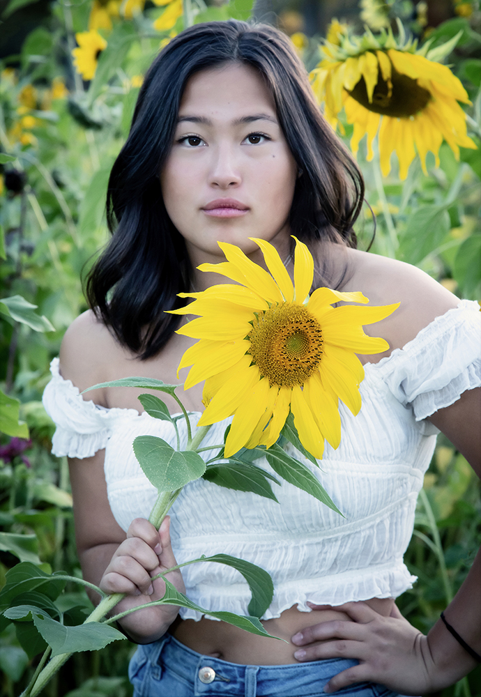 Young woman in sunflower patch