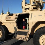 My son, Teo Principe, climbs in a 1117 Armored Security Vehicle during a family day visit to Fort Stewart, Georgia on November 15, 2016.