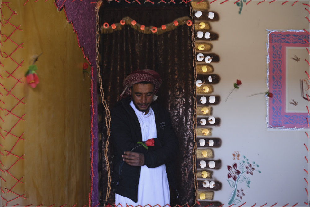 Embroidered photograph of Mahmoud in his home in AlTarfa village. Embroidery by his cousin Nora from AlTarfa village.