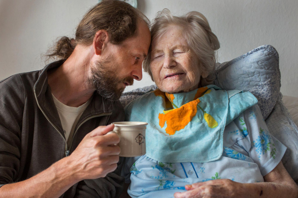 My brother Martin enjoys a cup of coffee with our grandmother. At the end of her life, in many ways, grandma became a child again and offered us the opportunity to give back the care we once received from her as kids.