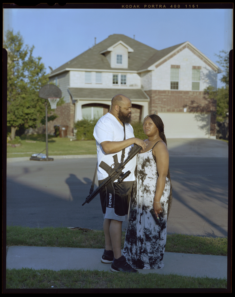 Justin Barlow, 34, left, gazes at wife Cha’von Barlow, 33, outside of their home on Saturday, June 18, 2021 in Round Rock, Tx. “I never want my family to feel powerless,” Justin said. He was introduced to guns at the age 14 through hunting. Later he introduced his wife to guns. “In my absence my wife and children will be safe,” he said.