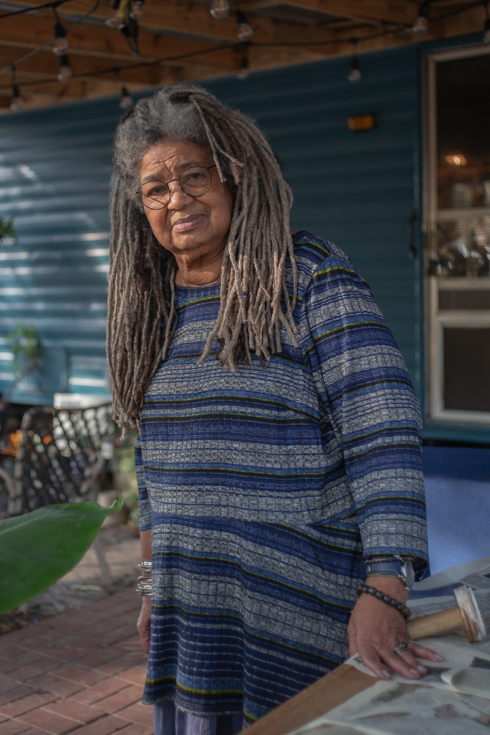 Textile artist and educator Arianne King Comer sits for a portrait, in Wadmalaw Island, South Carolina. King Comer, who has been an Artist in Residence for the State of South Carolina since 1995, describes the connection between indigo and South Carolina as "spiritual." In 2021, King Comer was Artist in Residence at Ashley Hall, a girls' preparatory school, in Charleston, South Carolina. “Indigo is the voice of our ancestors,” says King Comer.