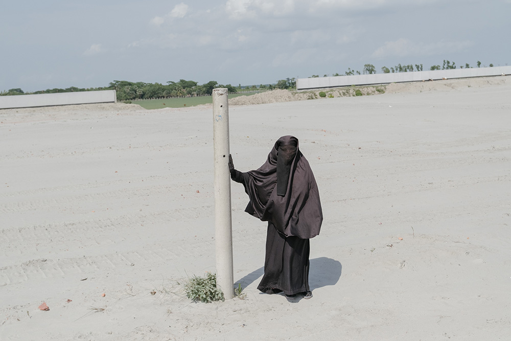 A displaced woman rokeya begum (60) visits the site of her former home and land. May 24,2018.