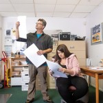 Alameda Sun owner, Eric Kos and copy editor Veronica Hall examine proofs of the weekly newspaper before sending it to the printing press on October 30, 2019 in Alameda. The Alameda Sun closed in 2023. © Ann Hermes 2019