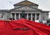 A counter protester is seen peeking out from a banner during a pre-election rally for the Young Alternative for Germany which is affiliated with the far-right party, Alternative for Germany or AfD on Saturday September 22, 2018 in Munich, Germany. (Photo by Matt McClain/ The Washington Post)