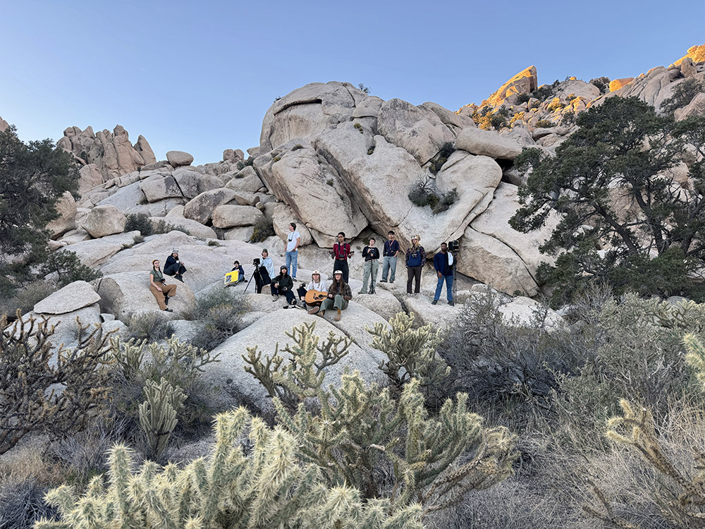 Students in UCSC Art Department’s Immersive Arts Field Research course, co-taught by Professors Karolina Karlic and Jonathan Jackson, at the Sweeney Granite Mountains Desert Research Center, Mojave Desert, California, 2025. Photo © Karolina Karlic. Overshoot with Yogan Muller.