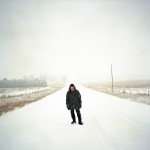 Jeanne Kilmurry stands in the road in front of her family's property near Atkinson, Nebraska where the Keystone XL pipeline would enter their land.