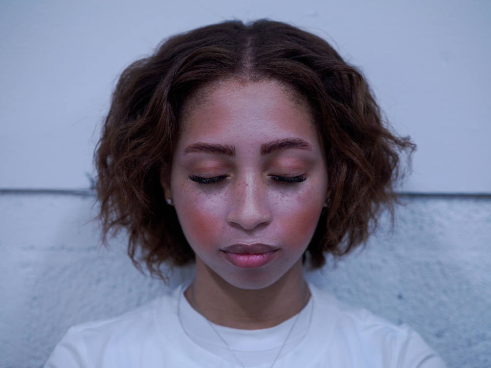 Amara Leak, 25, closes her eyes in prayer at the Juneteenth celebration in the Texana community of Murphy, North Carolina, June 20, 2026.