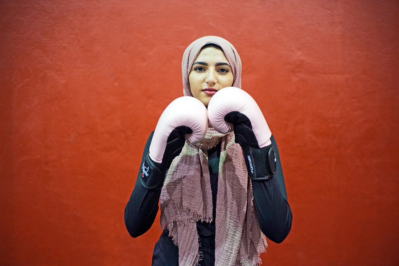 Mennah, 19 years old, born in Washington State, USA Political Science and Middle East Studies Student Middle Eastern Student Commission Director Passion: Kickboxing "People are always surprised that I kick box. Part of that is because my hijab is the only thing that defines who I am to people, and even though it's a conscious choice and I make it to present myself as visually Muslim, I think it's good to remember that everyone has layers to them and they aren't always what you'd expect. I'd like to be seen as all of it; a political scientist, a representative of my community, a muslim, a female, politically active, I like to kick box, and I perform poetry, and I like to do all these things people wouldn't expect." -Mennah